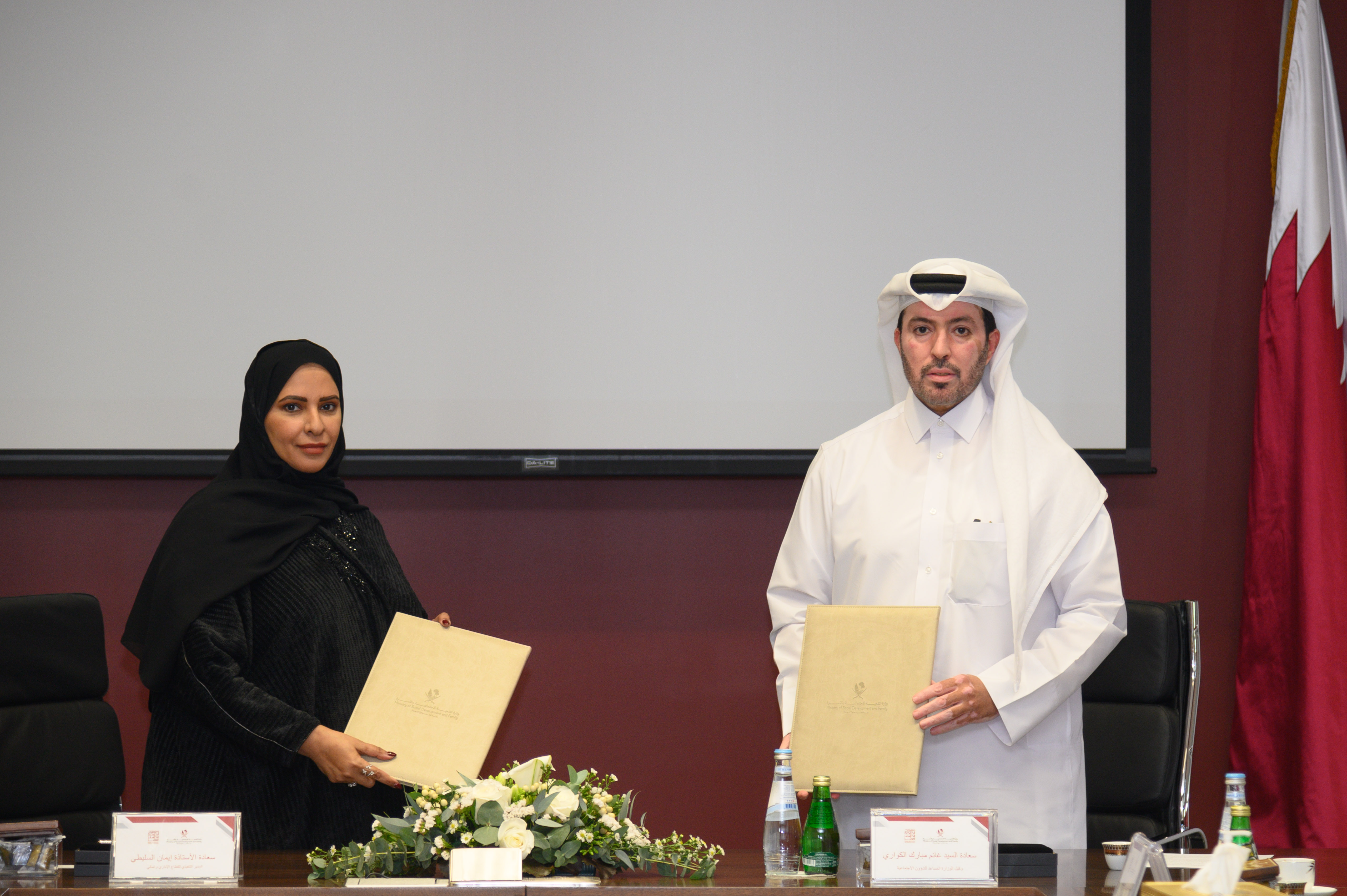 His excellency Mr. Ghanem Alkuwari with Ms. Iman Alsulaiti after signing the memorandum of understanding  